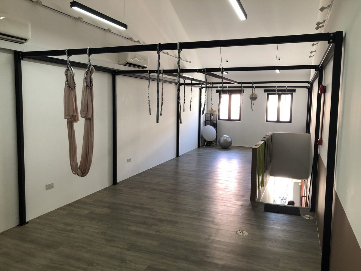 Freestanding custom aerial yoga rig fabricated for Her Tribe