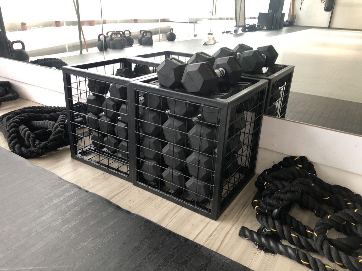 Custom compact dumbbell storage baskets for a gym
