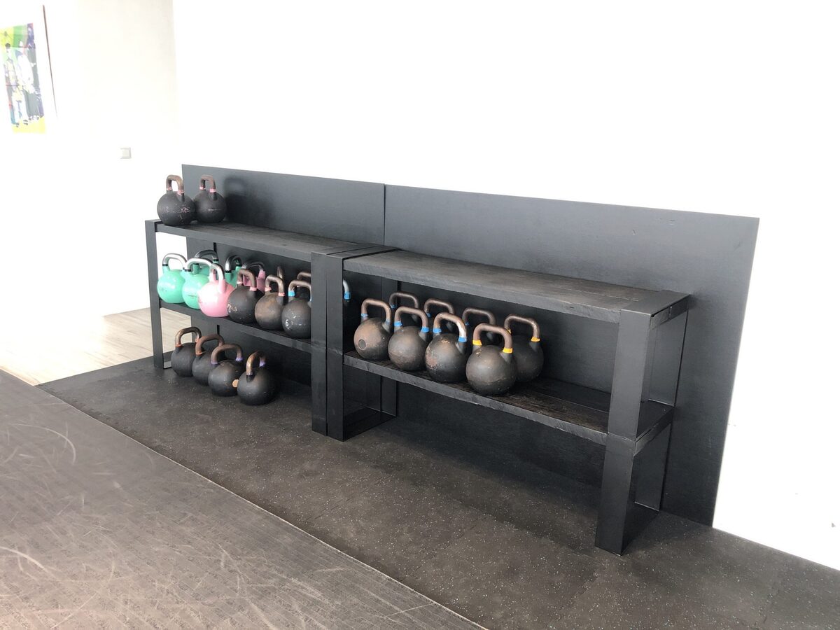 Old benches welded together and repurposed as kettlebell storage